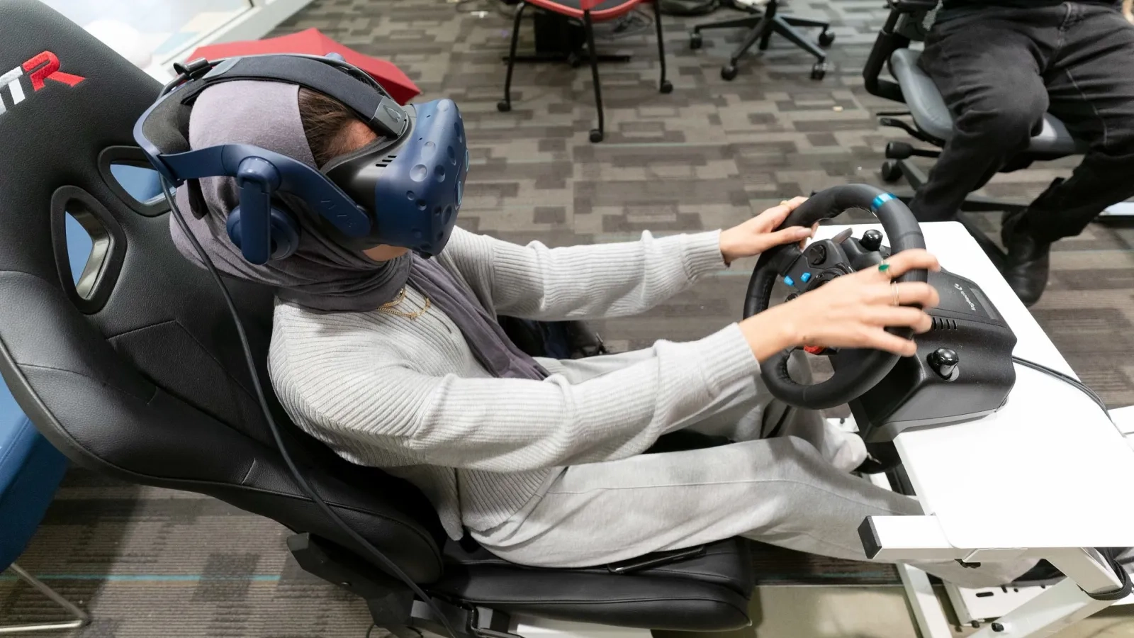 Student on VR driving simulator